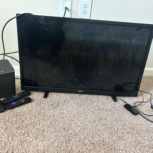 30in black Phillips tv that come with paid xfinity and an box.
